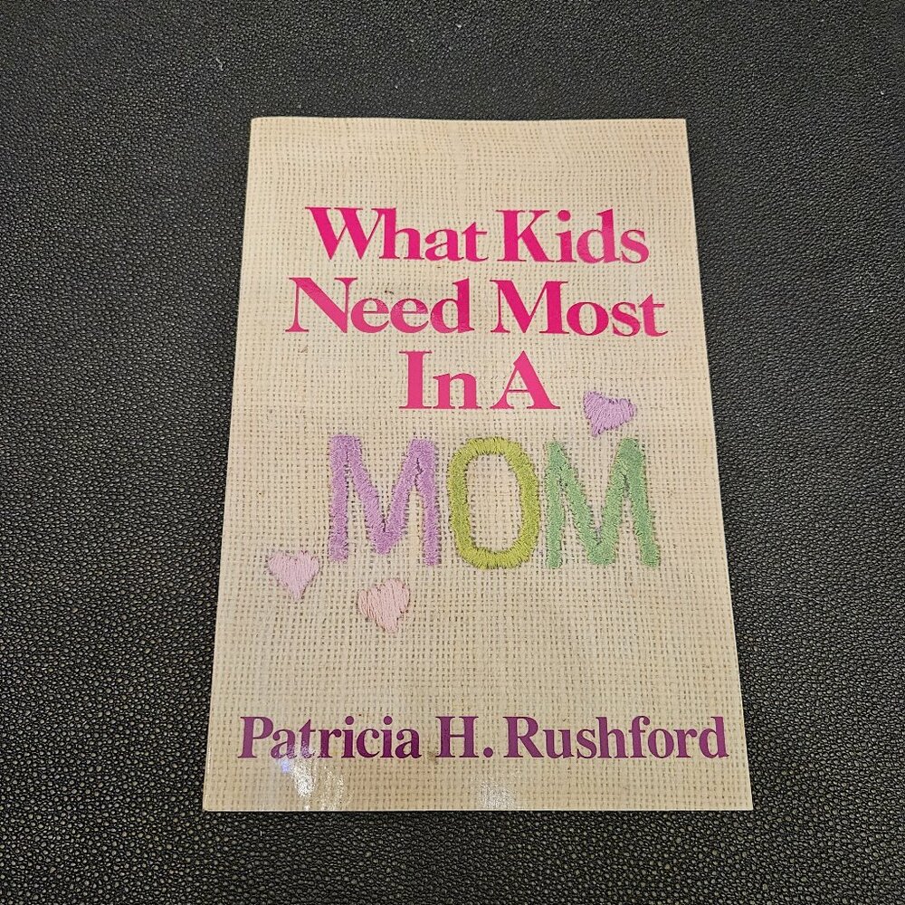 BRAND NEW "WHAT KIDS NEED MOST IN A MOM" PAPERBACK BOOK